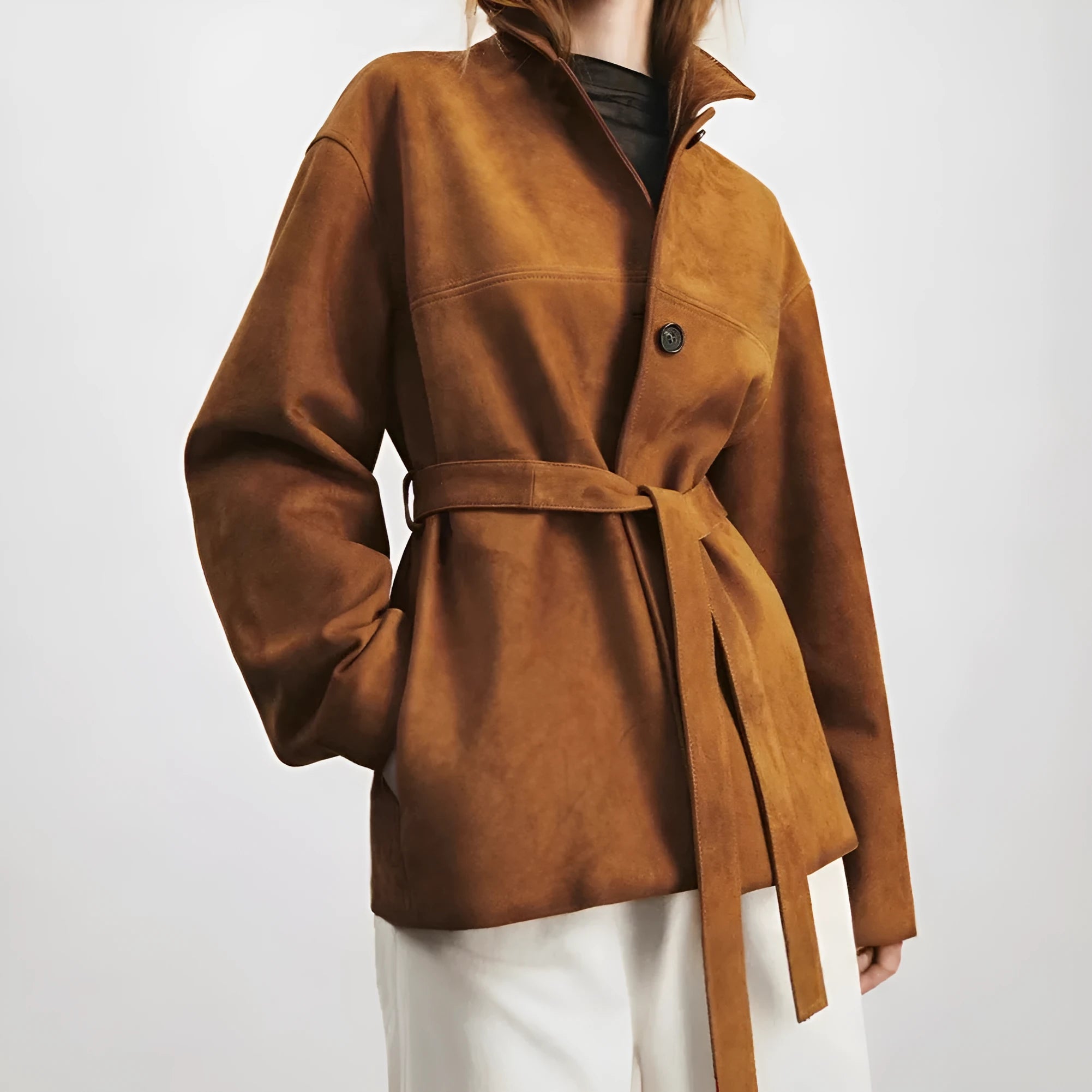 Women's mid-length art retro cashmere coat with Peter Pan collar and leather stitching in loose fit.