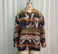 Women's loose retro-style wool coat with Aztec print in army green, shown from the front.