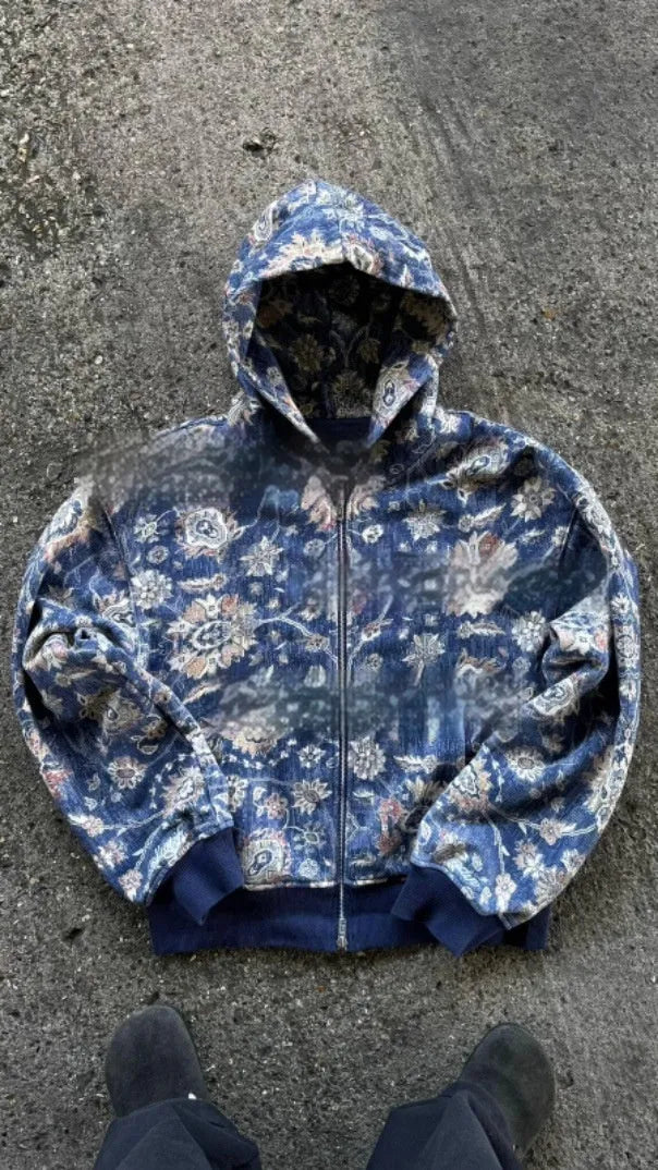 Man wearing a loose blue hooded zip-up coat with long sleeves for casual autumn wear.