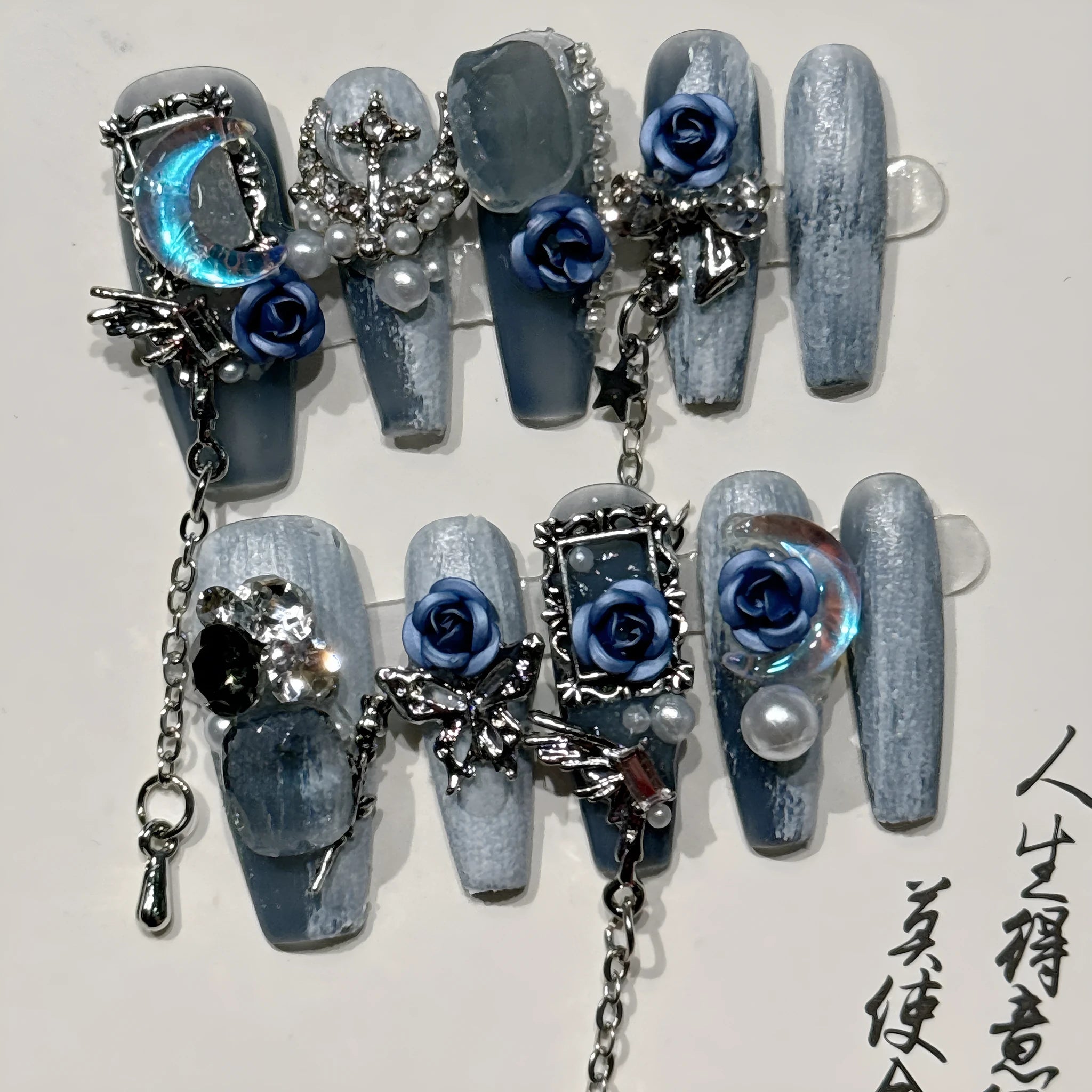 Wearable plastic nail armour suit in heavy industry night blue with ornate rose and tulip floral pattern.