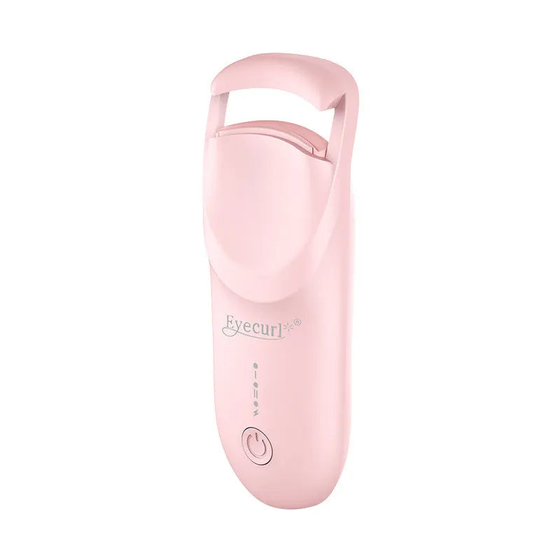 Electric heating eyelash curler in pink with USB charging cable on a white background
