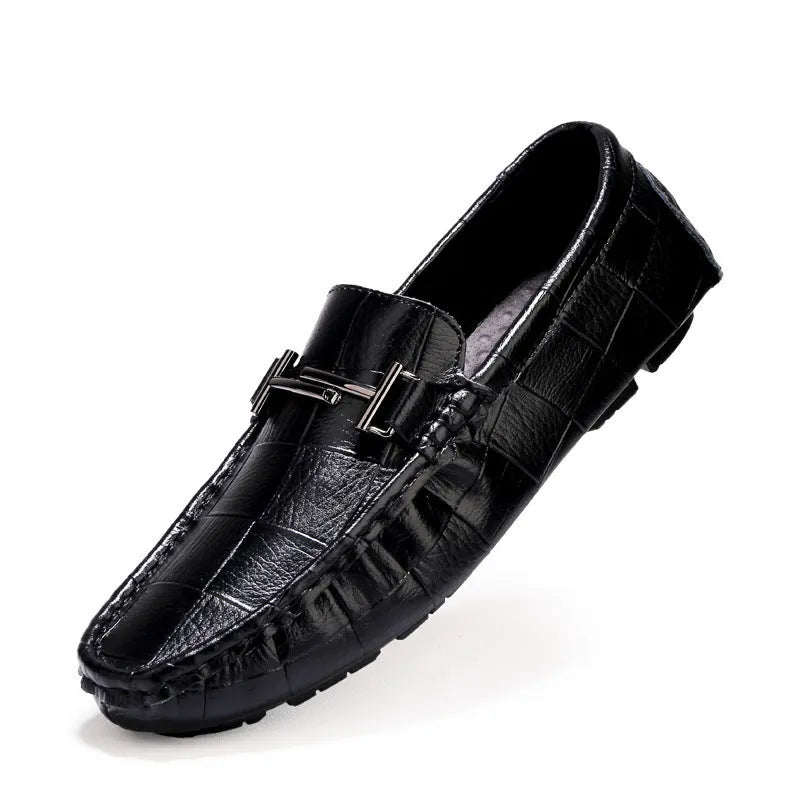 Men's brown leather casual loafers with a silver buckle on the front, shown from a side angle.
