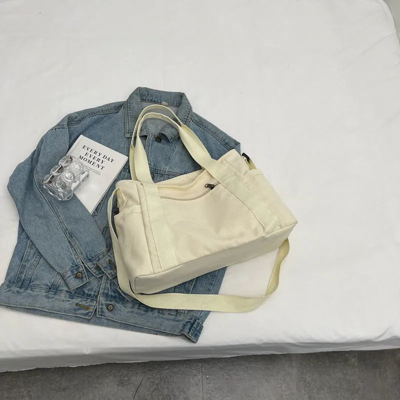 Women's polyester canvas shoulder bag with large capacity and mobile phone pocket in solid colour