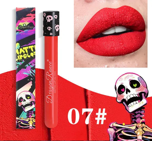 Halloween creative makeup lip gloss in skull-shaped test tube packaging, showing a matte gold and silver finish.