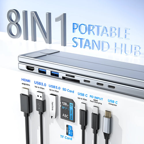 Silver aluminium alloy folding laptop stand with a built-in multi-port docking station hub.