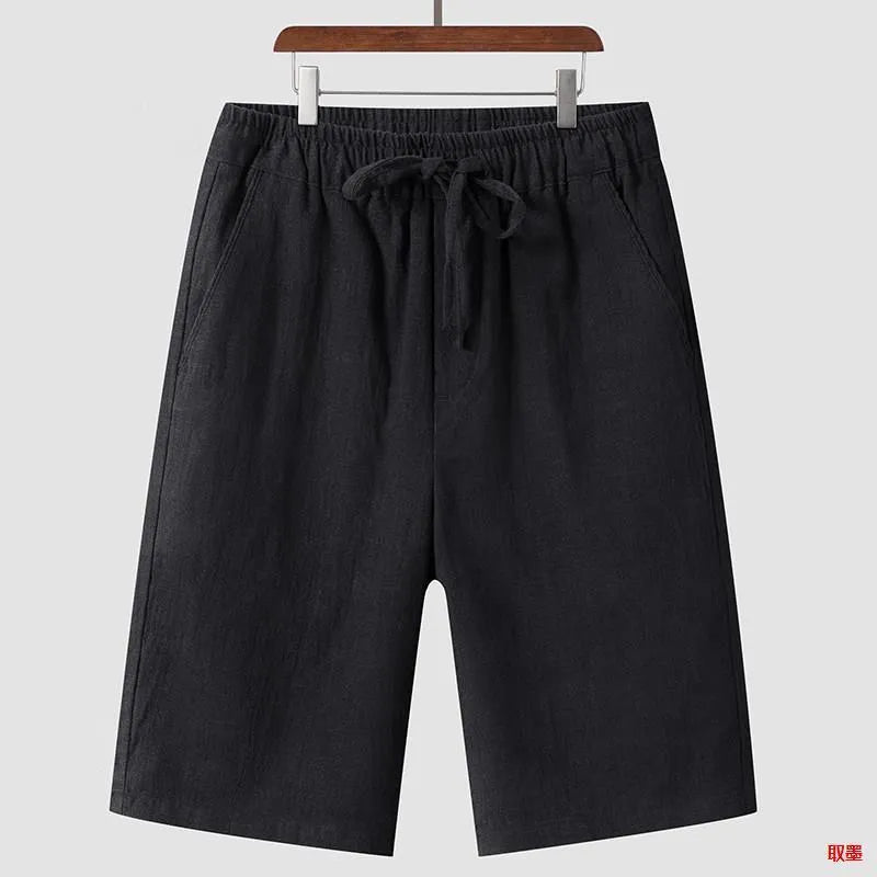 Men's linen shorts in loose cropped design with elastic waistband, shown in available colours