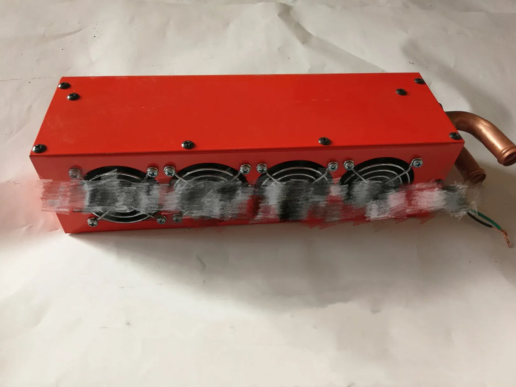 Metal car heater unit with copper pipe connections for 12V 24V auxiliary heating.