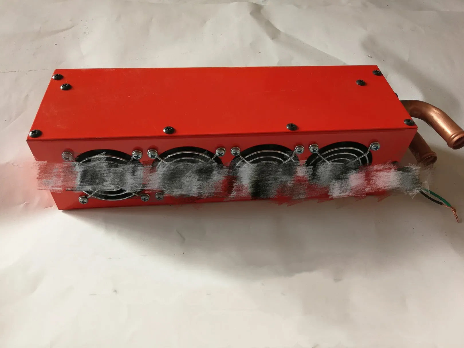 Metal car heater unit with copper pipe connections for 12V 24V auxiliary heating.