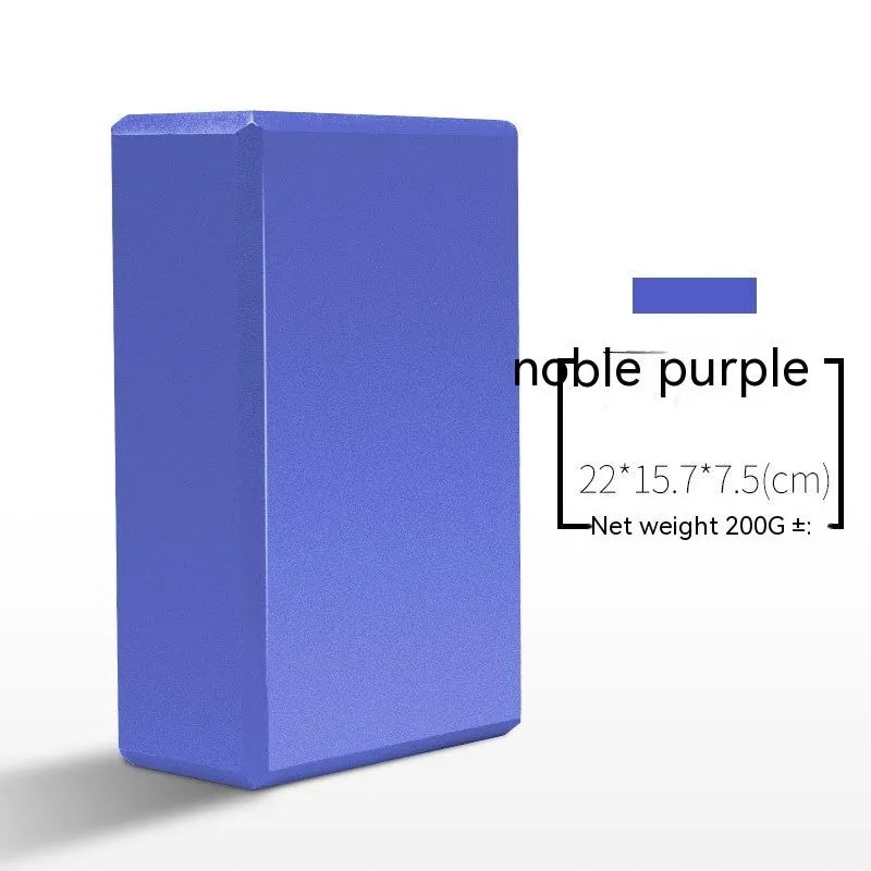 High-density EVA yoga block in violet colour next to a pink block with a cartoon print design.