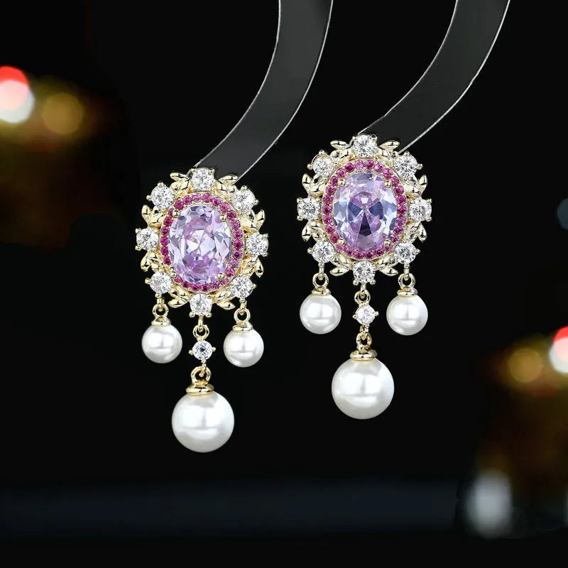 Oval-shaped copper earrings with zircon-inlaid pearls and long decorative tassels in light purple.