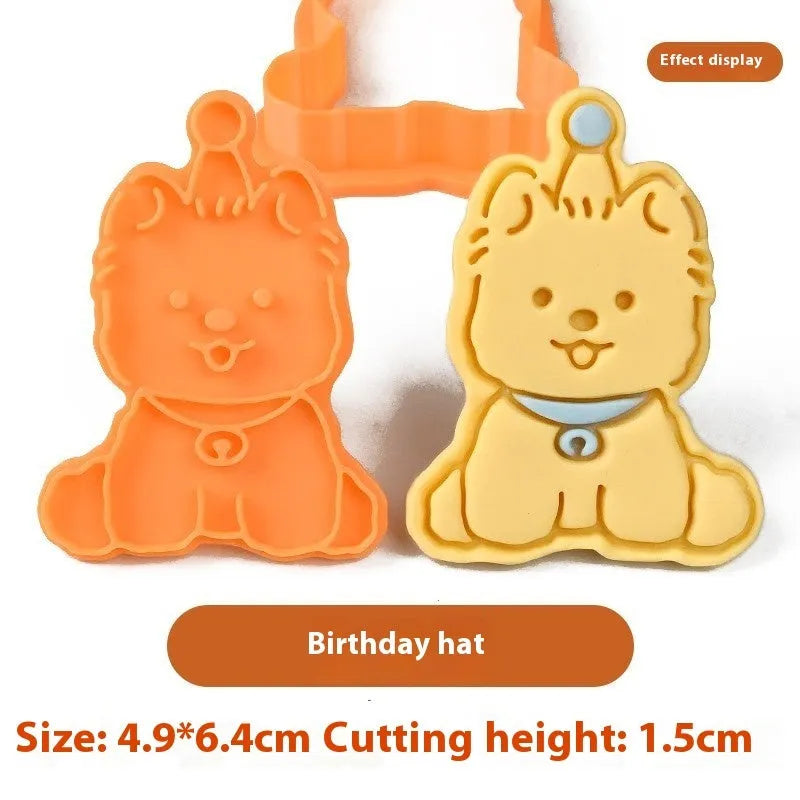 Plastic biscuit mould showing three-dimensional puppy head design with birthday hat for baking