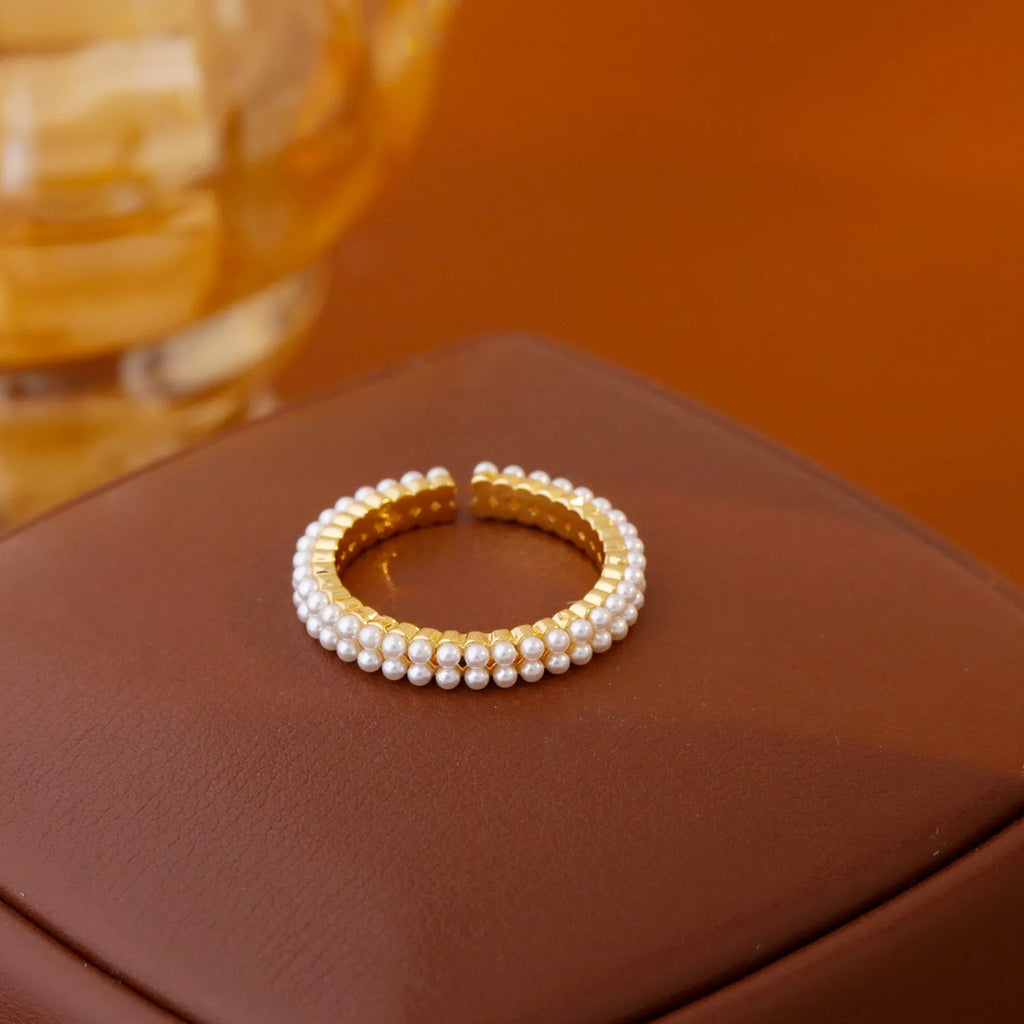 Gold electroplated open mouth ring with geometric design and round elements for women