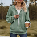 Green women's hooded zipper sweater jacket laid flat, showing casual loose fit and long sleeves.