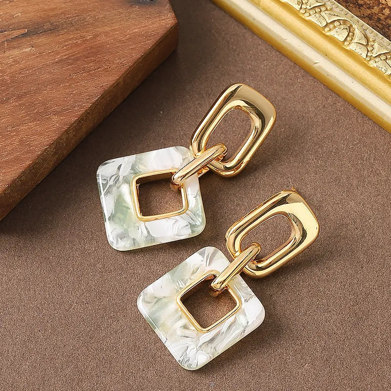 Geometric square hollow earrings with chamfered corners in electroplated copper