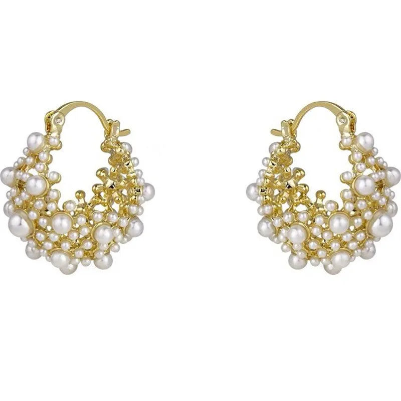 Gold copper flower basket earrings with small rice-shaped bead decoration and pearl inlay.