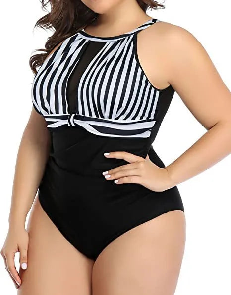 Women's black one-piece swimsuit with lace detailing on front, shown on mannequin.