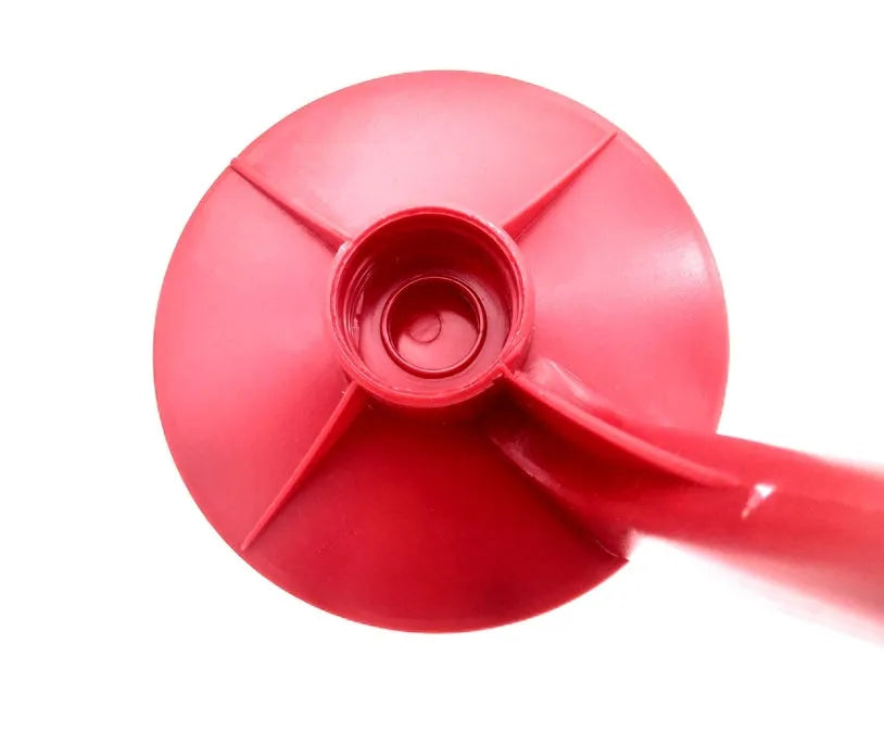 Red plastic Magic Tap soda dispenser attached to inverted 2 litre bottle