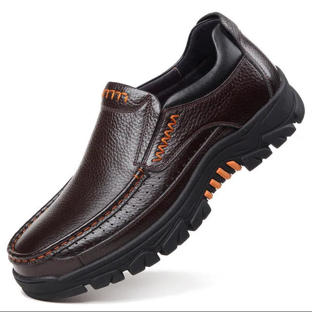 Men's black and brown business casual slip-on shoes made from soft cowhide leather with rubber soles.