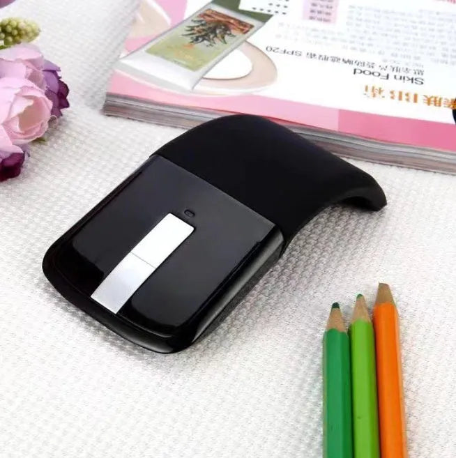 Black folding Bluetooth touch wireless mouse shown in open position with dimensions 131.2x55x14.5mm