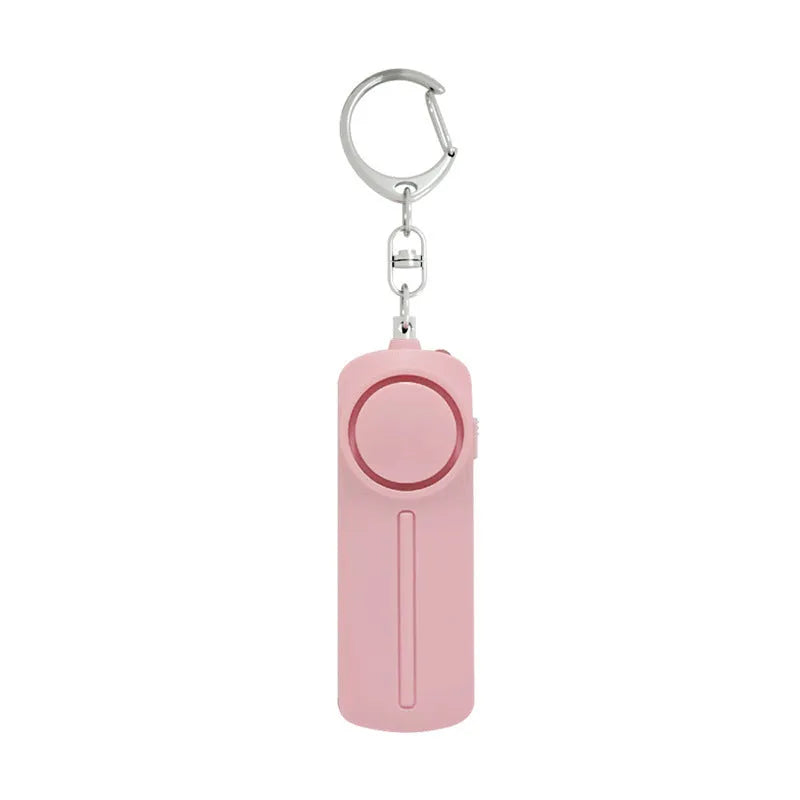 Compact pink personal safety alarm showing 130 dB siren specification and six-hour duration.