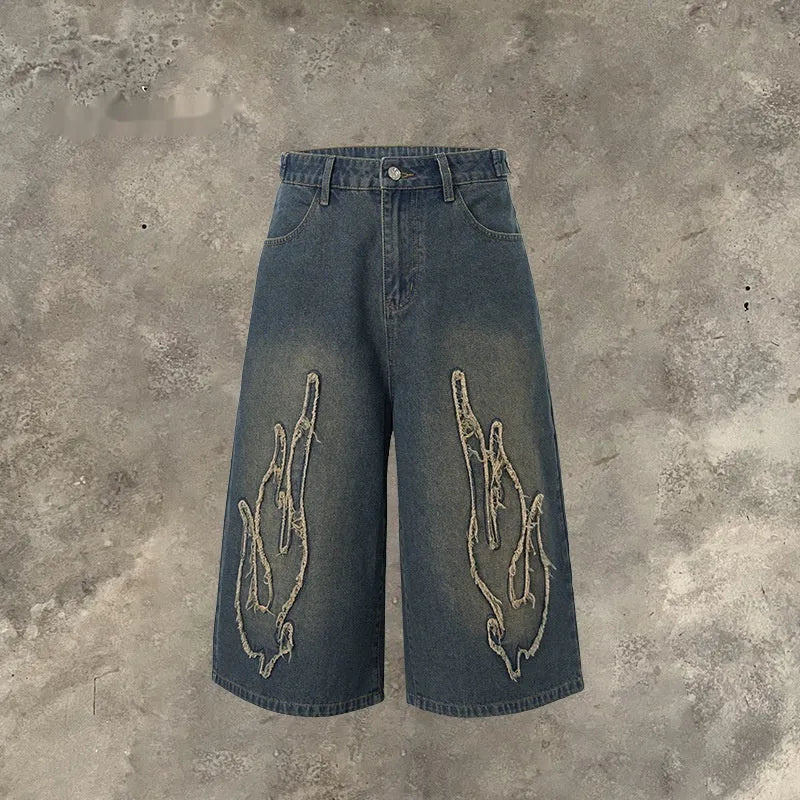 Men's black cotton denim shorts with flame embroidery patches and straight fit cut