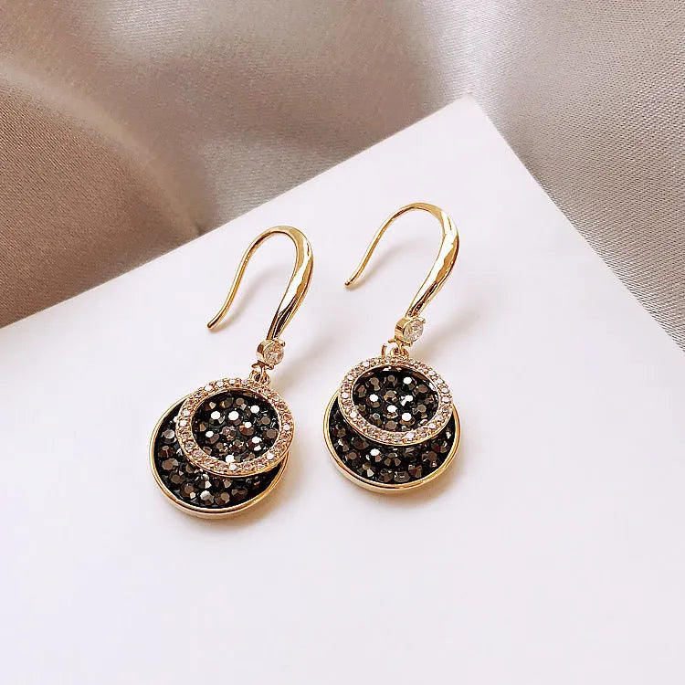 Black geometric alloy drop earrings with round piece design measuring 3.6cm in length