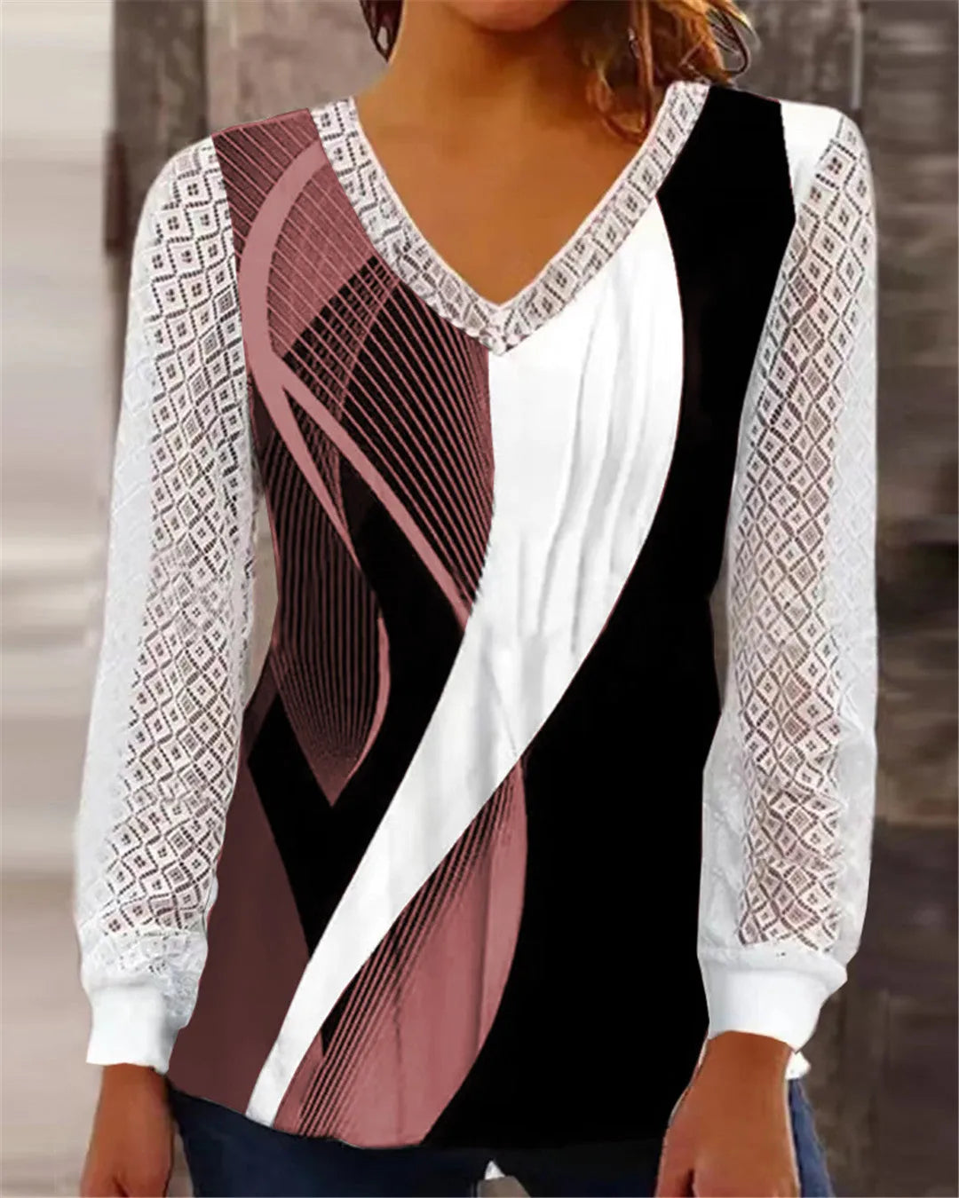 Purple v-neck loose lace top with hollow-out pattern and long sleeves on hanger