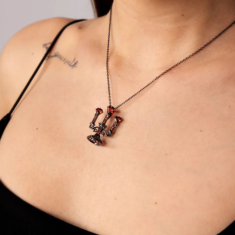 Women's retro gothic necklace with hollow candlestick pendant and cross chain in antique finish.
