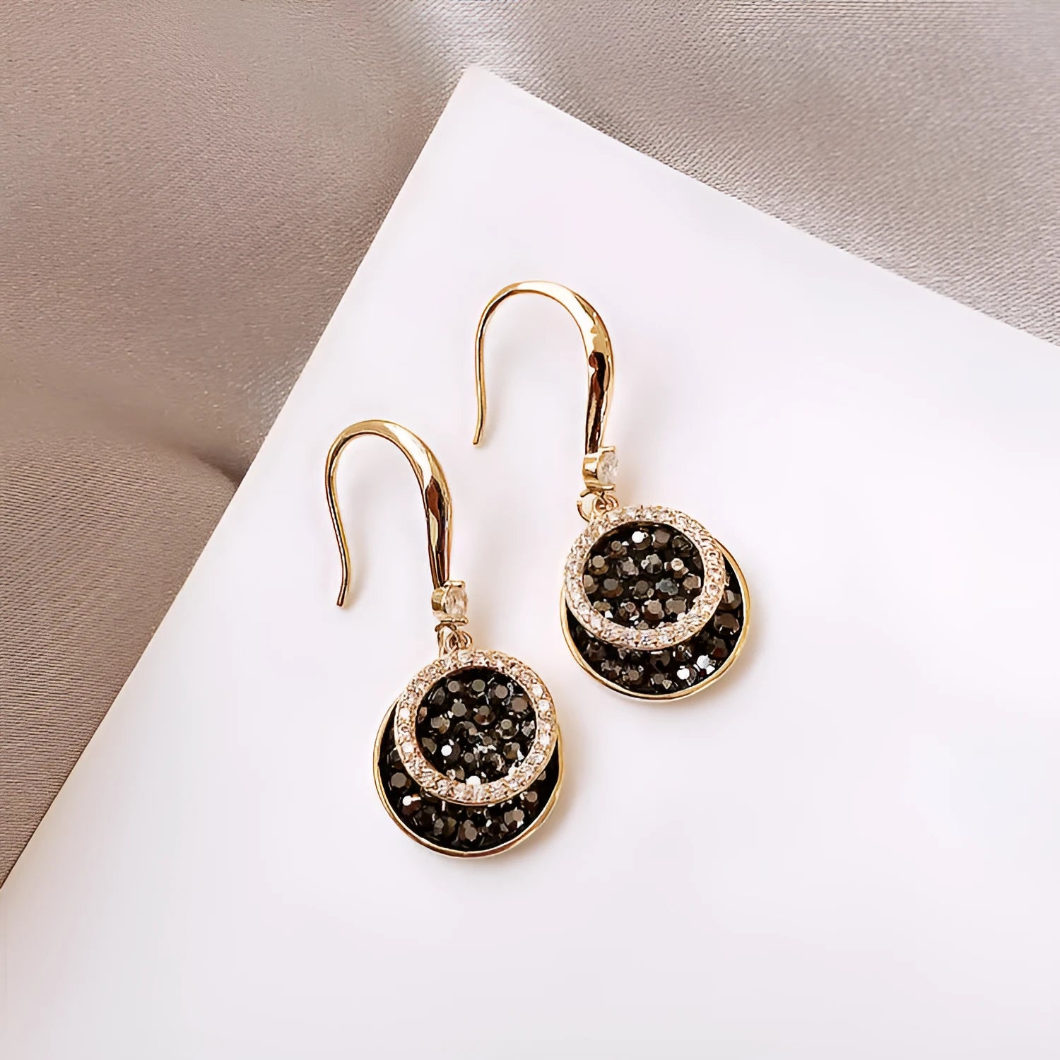 Black geometric alloy drop earrings with round piece design measuring 3.6cm in length