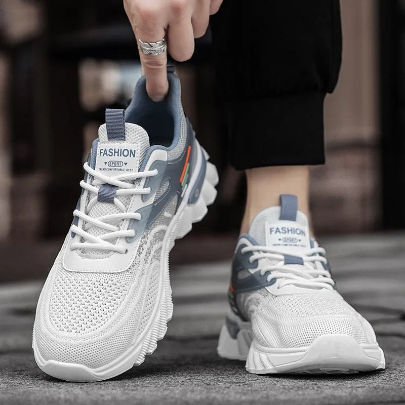 Men's white blue and black platform casual sports shoes with cross straps and mesh upper.
