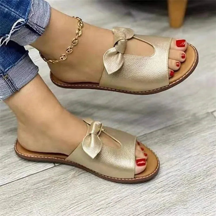 Ladies sandals with fish mouth style and bow detail in black, pink, or gold colours