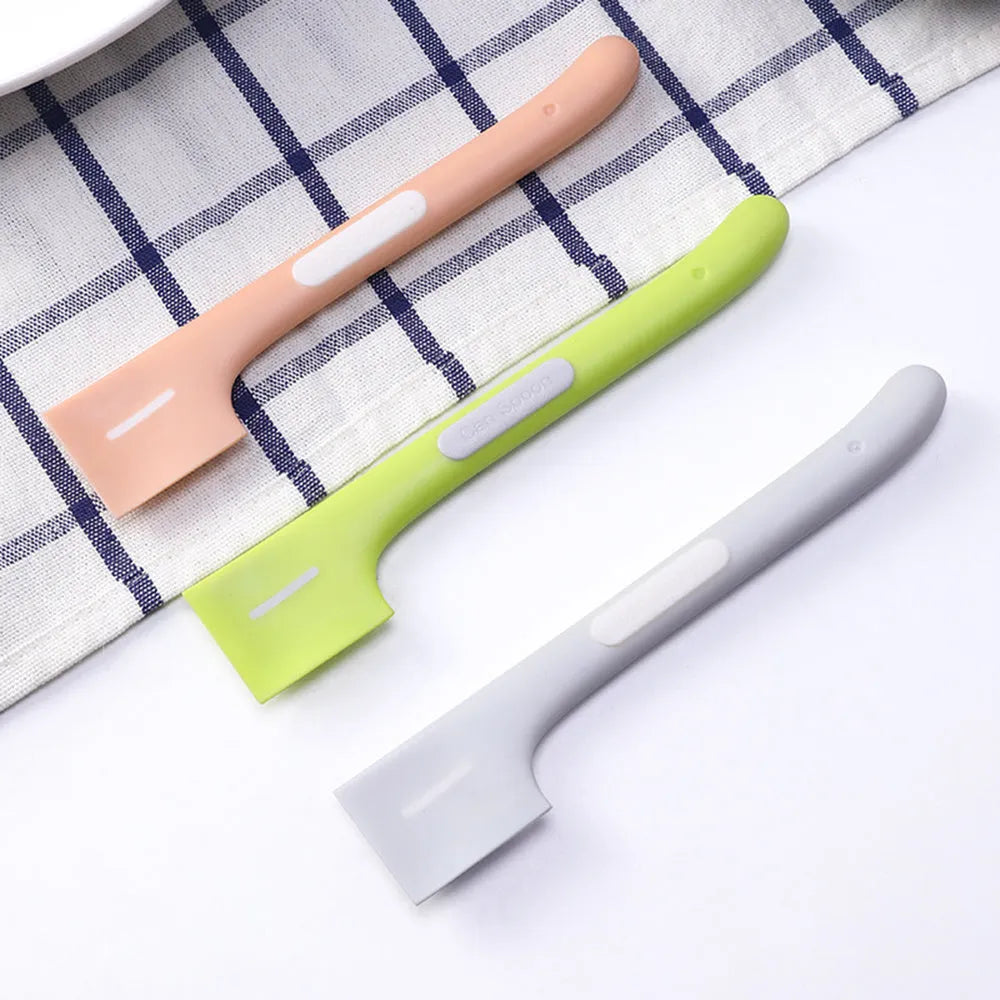 Long-handled green pet food spoon for canned wet food with angled scraper design