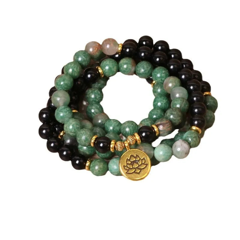 Green and black alloy beaded elastic bracelet with stretch band on wrist