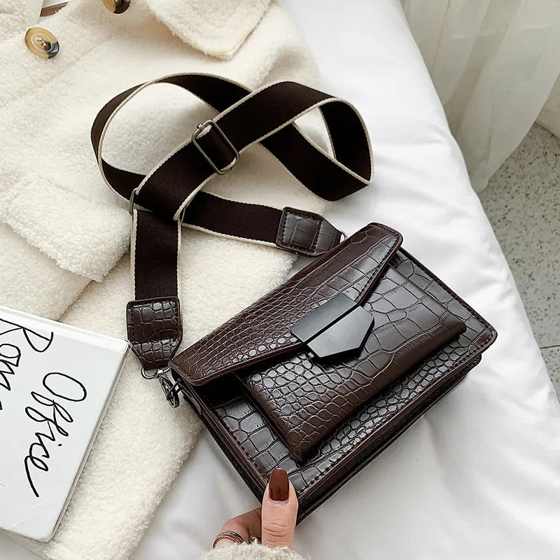 Vintage-style black PU leather crossbody bag with dimensions 20cm by 14cm by 7cm.