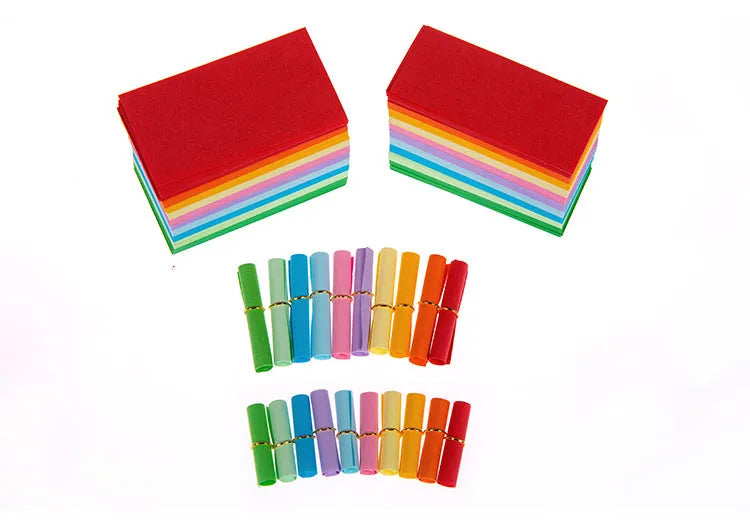 Assorted colour mini paper scrolls with punched holes for drift bottle notes and crafts.
