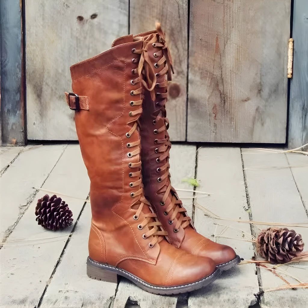Chunky low heel high leg boots in black, brown, and wine red with rounded toe.