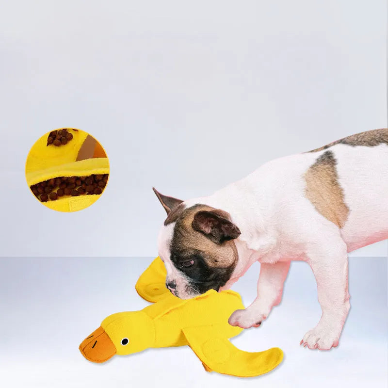 Yellow plush duck dog toy with treat compartments and squeaker for training