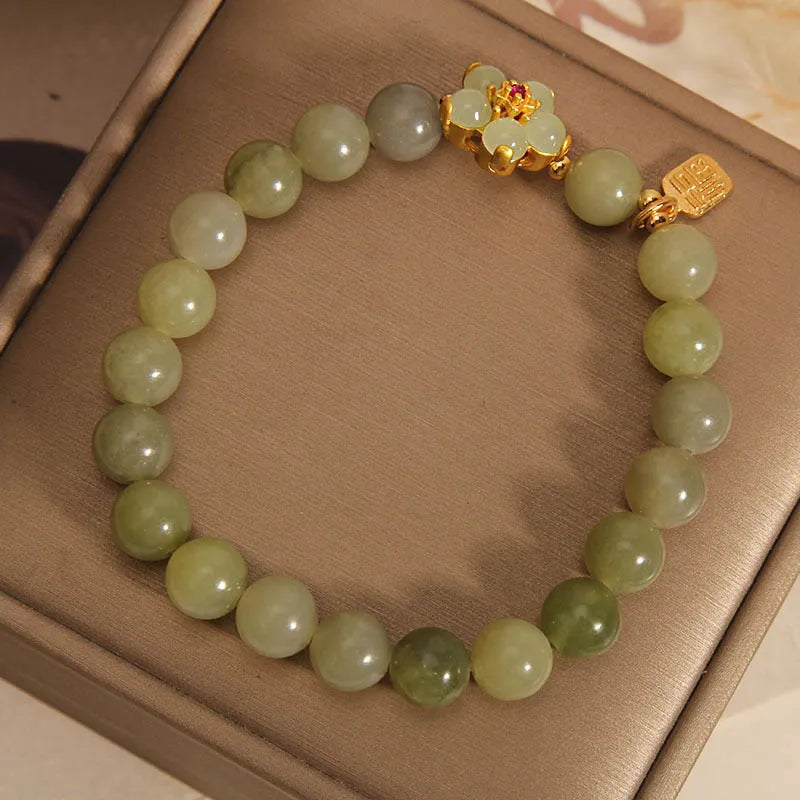 A women's casual alloy bracelet with a grey jade colour finish and a clasp.