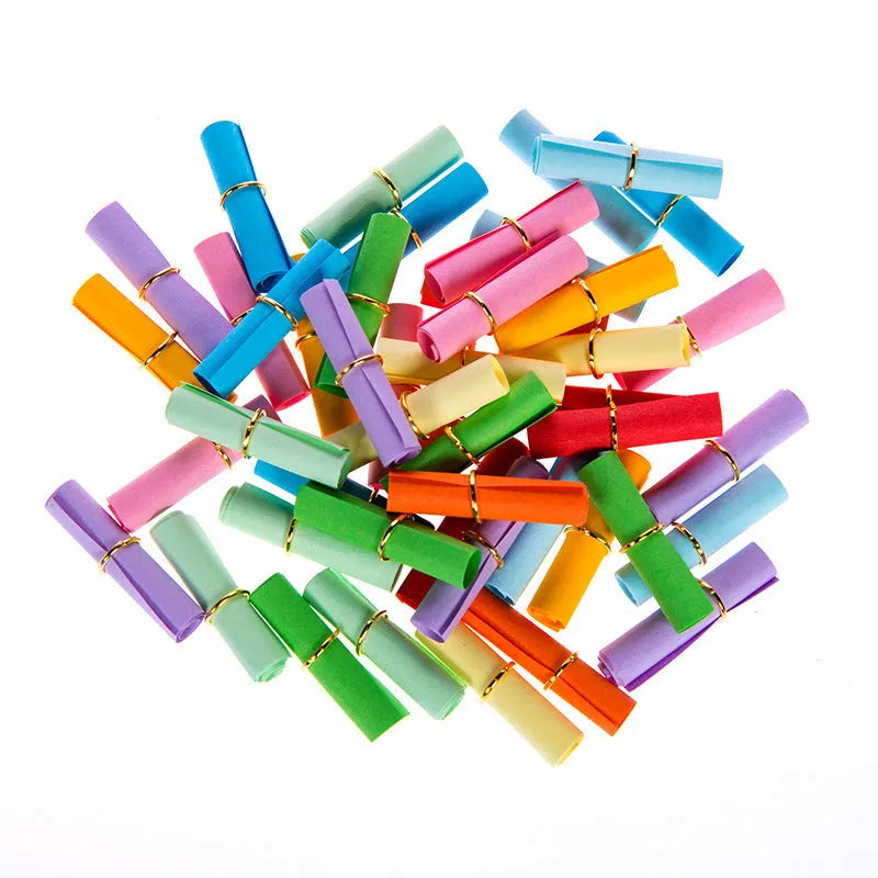 Assorted colour mini paper scrolls with punched holes for drift bottle notes and crafts.