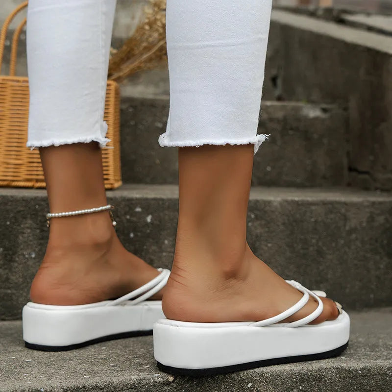 Thick rubber sole flip-flops in multiple colours with round toe shape and PU upper material