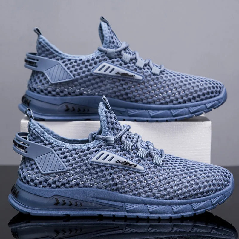 Men's beige mesh sneakers with lace-up front and synthetic leather upper on a flat EVA sole.