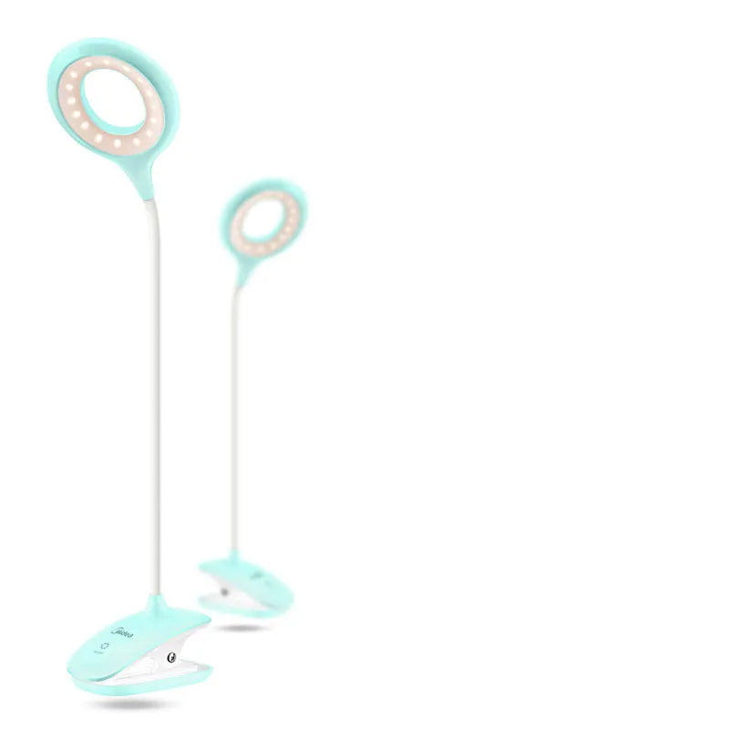 Green, pink, and white USB rechargeable table lamp with a touch switch on a wooden desk.