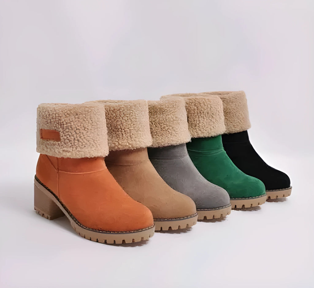 Women's thick suede mid-calf snow boots with a round toe, flat low heel, and waterproof platform sole.