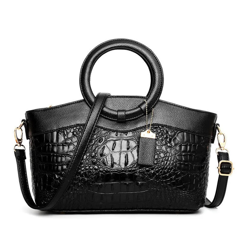 Fashion handbag in fabric with shoulder strap, showing internal phone and card compartments