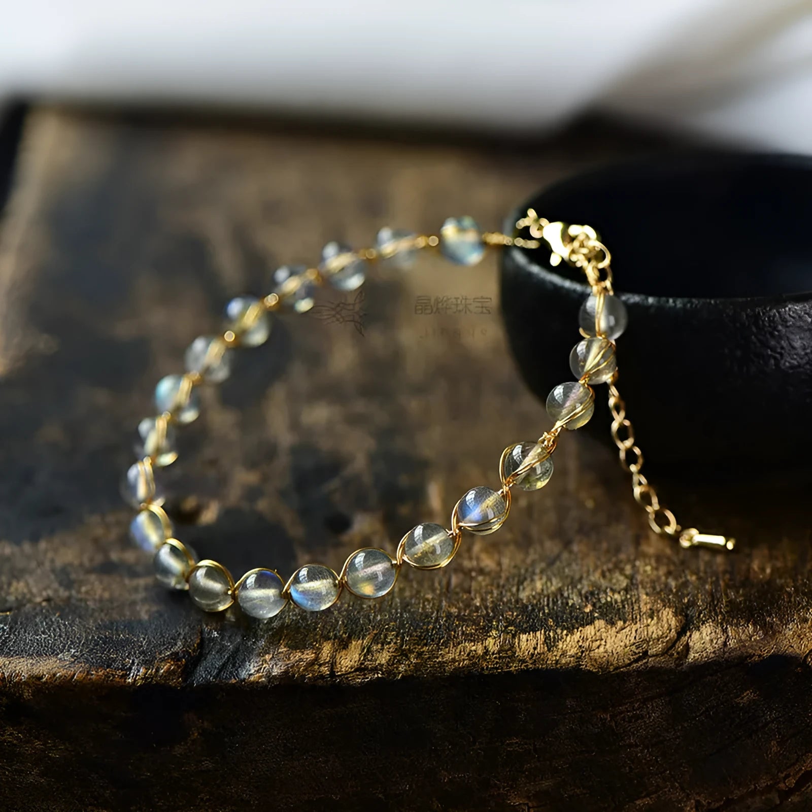 Women's blue moonstone bracelet with 6mm crystals in 14K gilded setting featuring starry sky design