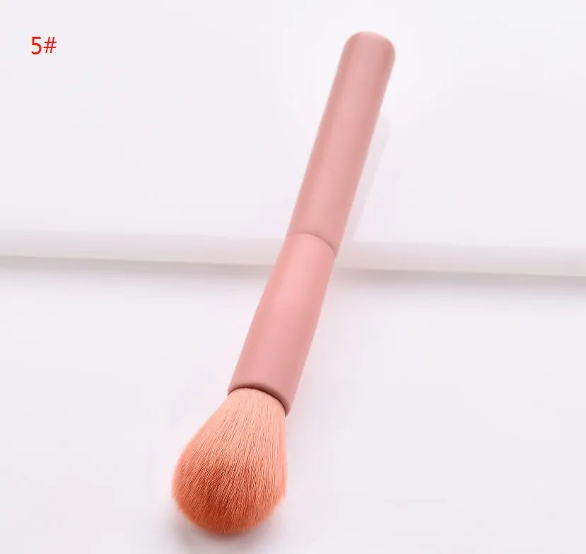 Ten-piece wooden handle makeup brush set with nylon bristles including powder, foundation, and double-ended brushes