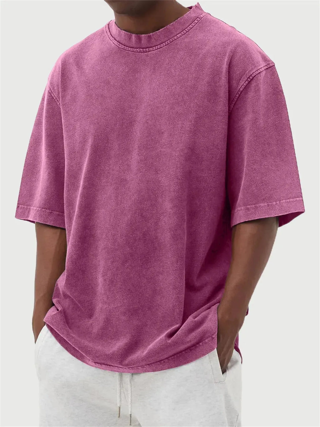 Men's loose fit pullover T-shirt in a stone-washed distressed solid colour, shown in army green.