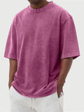 Men's loose fit pullover T-shirt in a stone-washed distressed solid colour, shown in army green.
