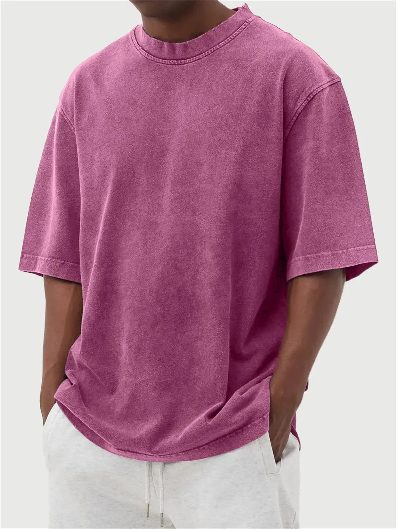 Men's loose fit pullover T-shirt in a stone-washed distressed solid colour, shown in army green.