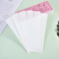 A pack of soft, white non-woven fabric hair removal wax paper strips.